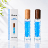 Flacon de parfum en verre de 10 ml avec bouchon en bois, atomiseur de parfum texturé en relief avec emballage en boîte, vente en gros