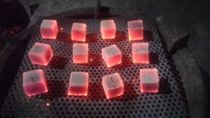 Our Indonesian-produced coconut shell charcoal <b>cube</b> briquettes <b>light</b> up quickly. - Product Image 2
