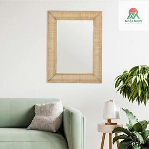 Un espejo de pared impresionante con marco de madera y exquisitos detalles de ratán tejido, en color marrón. - Product Image 1