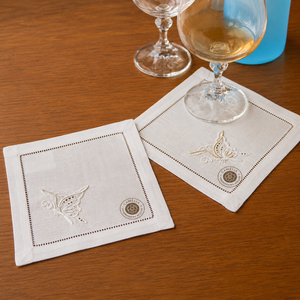 Elegant <b>linen</b> cocktail napkin with subtle embroidery, designed for refined and practical entertaining. - Product Image 1