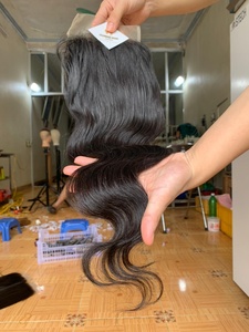 Ventes en gros à prix avantageux de mèches de cheveux humains vietnamiens ondulés avec fermeture en dentelle, 100% cheveux humains vietnamiens bruts non traités - Product Image 3