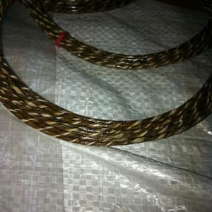 image is of a hank of braided <b>cord</b>, likely made from natural materials such as <b>leather</b> or gut - Product Image 4
