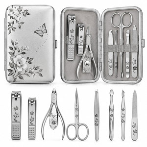 Kit de manucure et pédicure en acier inoxydable 7 pièces avec motif floral dans un étui métallique - Product Image 1