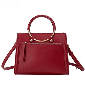 Structured Fashionable Burgundy Red Handbag <b>With</b> Circular Metal Top Handle, Front <b>Zip</b> Pocket and Adjustable Shoulder Strap - Product Image 1