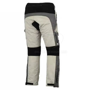 Combinaison textile élégante pour moto, idéale pour les longues balades, offrant un tissu respirant, des protections et une coupe ajustable. - Product Image 5