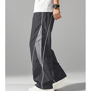 Pantalon cargo technique en nylon personnalisé pour homme, coupe ample, style parachute, avec plusieurs poches, pour l'extérieur, grandes tailles - Product Image 3