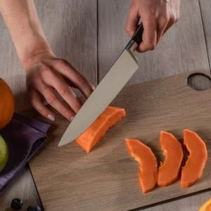 Cuchillos Santoku con mango negro, hoja plateada hueca y agarre remachado para cortar verduras, rebanar carne y cocinar en la cocina - Product Image 6