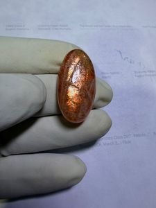 พลอยซันสโตนสีส้มธรรมชาติทรงหลังเบี้ย ประกายทองและเปลี่ยนสีได้ เหมาะสำหรับแหวน จี้ และงานออกแบบเครื่องประดับระดับพรีเมียม - Product Image 2