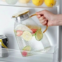 Vente en gros de carafes à eau en verre borosilicate de haute qualité personnalisées de 1500 ml et 1800 ml avec couvercle en métal pour le thé et le café