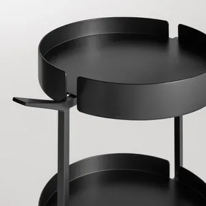 Chariot utilitaire moderne en métal rond avec trois étagères et roulettes, design minimaliste, finition noire - Product Image 4