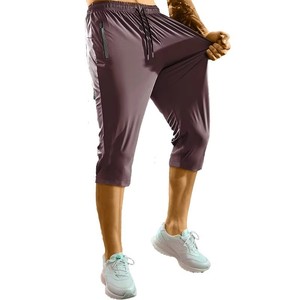 Pantalon de survêtement capri pour homme, violet, taille élastiquée avec cordon de serrage, séchage rapide, tissu satiné, couleur unie, style sportif, taille mi-haute avec poches zippées - Product Image 1