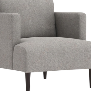 Ce fauteuil Dania présente un design minimaliste moderne et élégant avec un revêtement en tissu gris clair. - Product Image 3