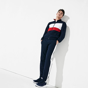 Ensemble de survêtement décontracté pour homme de qualité supérieure. Veste légère à fermeture éclair et pantalon de jogging à rayures latérales. Tissu réversible respirant et écologique - Product Image 1