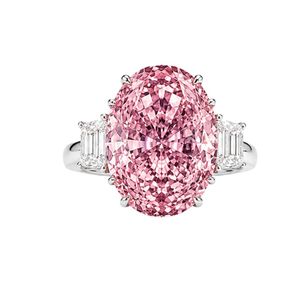 Extraordinary <b>statement</b> <b>ring</b> in platinum finish 18K white gold with fancy pink oval diamond and tapered baguette side diamonds - Product Image 1