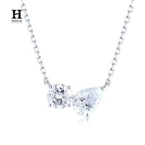 Collier pendentif en or 18 carats avec deux diamants, comprenant des diamants ronds et en forme de poire - Product Image 1