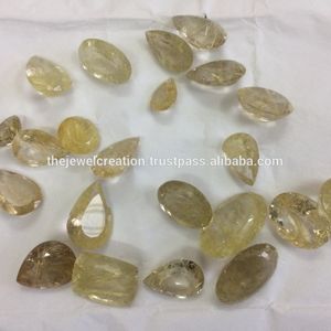 Cuarzo rutilado dorado natural de 10mm y 20mm, proveedor de piedras preciosas sueltas calibradas con pera redonda ovalada facetada a precio mayorista Regular - Product Image 1