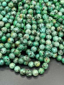 ลูกปัดหินเทอร์ควอยซ์แอฟริกันธรรมชาติทรงกลม สีเขียวฟ้าสวยงาม ประดับด้วยจุดสีดำ สำหรับทำเครื่องประดับ - Product Image 5