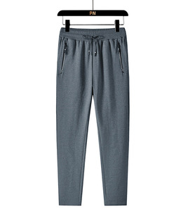 Pantalon de survêtement gris pour homme, taille élastique avec cordon de serrage, décontracté, devant plat, poches latérales, tricoté mi-lourd, style automne 2027 - Product Image 1