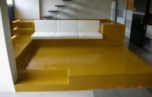 Modern sunken living room with glossy yellow epoxy <b>floor</b> and built in white <b>sofa</b> seating interior design - Product Image 4