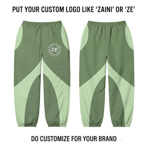Pantalon coupe-vent léger réversible en coton 100% 110 GSM de qualité supérieure, vert sauge et menthe, avec empiècements contrastants et logo personnalisé imprimé à l'écran - Product Image 1