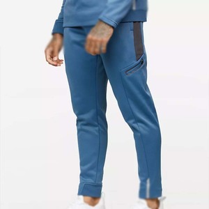 ชุดวอร์มผู้ชายสีน้ำเงินแบบ Color Blocking แขนยาว ซิปครึ่งตัว กางเกงจ็อกเกอร์ทรงสปอร์ตมีกระเป๋าข้าง ทรงปกติ เหมาะสำหรับใส่ในฤดูใบไม้ร่วง - Product Image 4