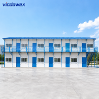 VICDOWEX Maison préfabriquée de type K à assemblage rapide, panneau sandwich en acier, design modulaire contemporain pour projets de bureaux et utilisation en campement