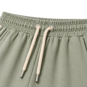 Conjunto de dos piezas informal personalizado para mujer, camiseta de manga corta verde salvia y beige y pantalones rectos largos, con detalles en contraste. - Product Image 4