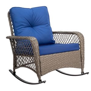 Sedia a dondolo in rattan grigio con schienale spesso e cuscino blu - Product Image 1