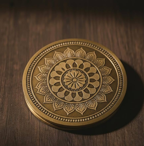 Circular textured brass coaster featuring a central floral stem design and a <b>beaded</b> rim, available at wholesale prices. - Product Image 2
