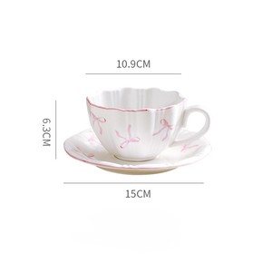 Encantadora taza de té de café de cerámica minimalista con adorable patrón de nudo de mariposa - Product Image 5