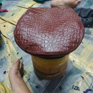 This is a brown crocodile-embossed leather Caps - Product Image 1