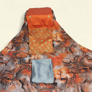 Tela de Lujo Color Naranja Óxido con Estampado Floral Suizo Dirac y Panel Bordado en Oro para Vestidos de Boda Somalíes - Product Image 1