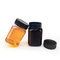 Bouteille de miel noire transparente en PET pour 500g de miel