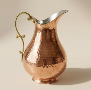 Classic hammered pure <b>copper</b> pitcher with an elegant curved brass <b>handle</b>. Durable drinkware available at wholesale price. - Product Image 1