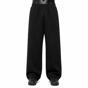 Pantalon de jogging unisexe noir à jambe large pour homme, taille élastique, poches latérales, idéal pour le printemps, 100 % coton, écologique et respirant - Product Image 1