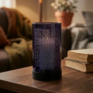 Porte-bougie votif en métal noir avec découpe florale pour une ambiance lumineuse et chaleureuse - Product Image 1