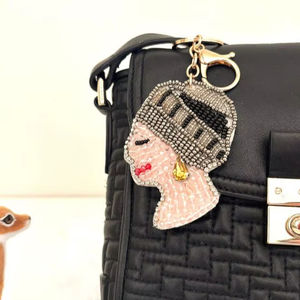 พวงกุญแจรูปดอกไม้ประดับลูกปัดแก้ว งานแฮนด์เมด ตกแต่งด้วยคริสตัลปักลาย พร้อมจี้ห้อยกระเป๋า สีส้มแดง - Product Image 1