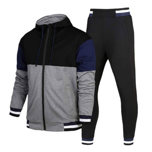 Ensemble de survêtement pour homme avec veste zippée à blocs de couleurs rouge, blanc et noir, col montant et coupe régulière, et pantalon de survêtement respirant et sportif - Product Image 5