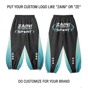 Pantalon coupe-vent léger en coton 100% premium 120 GSM, réversible, avec cordon de serrage, design à empiècements noir et turquoise, style streetwear - Product Image 1