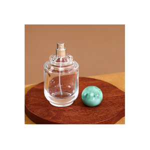 Flacon de parfum rechargeable haut de gamme en verre 100 ml avec corps rond transparent, col à sertir et capuchon de protection, conçu pour les parfums - Product Image 2