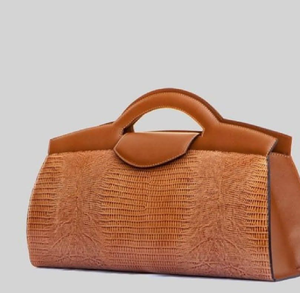 Sophisticated tan lizard-print textured bag with a sleek top handle. Timeless grace. Available at wholesale prices. - Product Image 1