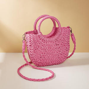 Complementa tus atuendos para el clima soleado con este encantador bolso de hilo natural con una silueta curva marrón y asas, disponible hoy. - Product Image 3