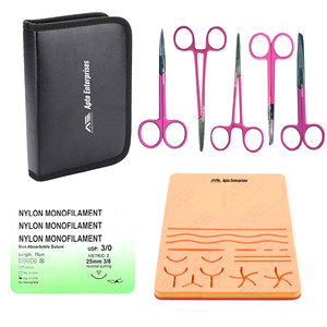 Kit d'entraînement à la suture chirurgicale manuelle en acier inoxydable avec pinces et ciseaux, certifié CE, garantie à vie - Product Image 1