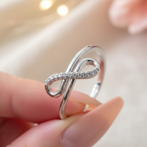 Anillo de compromiso y aniversario de boda de plata de ley 925 con circonita cúbica y diseño de infinito cruzado, deslumbrante y moderno para mujer, 0.10 - Product Image 2