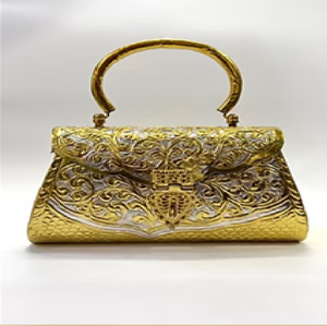 Cylindrical golden brass hand clutch embellished with delicate <b>net</b> patterns and <b>green</b> stone accents,at wholesale prices. - Product Image 3