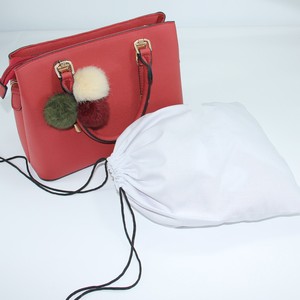 Red Leather Handbag With <b>Pom</b> <b>Pom</b> Charms And White Dust Bag Included - Product Image 1