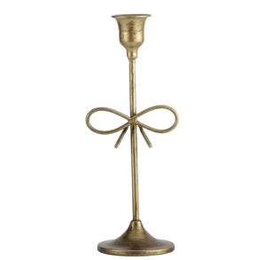 Portavelas de diseñador de tendencias superior con acabado dorado, soporte de vela de diseño de lazo de lujo para el hogar, Villa, cena y diseño de boda - Product Image 1