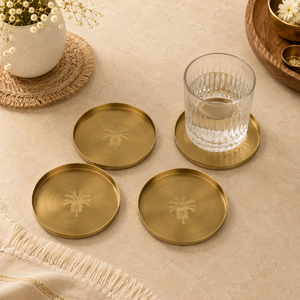 Set of four round brass coasters featuring traditional <b>painted</b> lotus floral artwork, available at wholesale prices. - Product Image 6