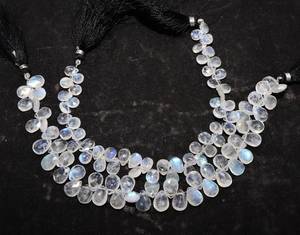 ลูกปัดมูนสโตนสีขาวรุ้งธรรมชาติทรงหยดน้ำเจียระไนขนาด 7x10 มม. มูนสโตนสีขาวรุ้งทรงบริโอเล็ต ความยาว 8 นิ้ว เกรดพรีเมียม - Product Image 1