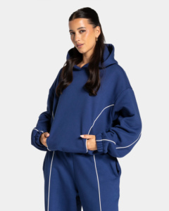Ensemble de survêtement tendance pour femme, bleu marine, à capuche, coupe ample, longueur intégrale, couleur unie, poches latérales, 100% coton, avec passepoil. - Product Image 4